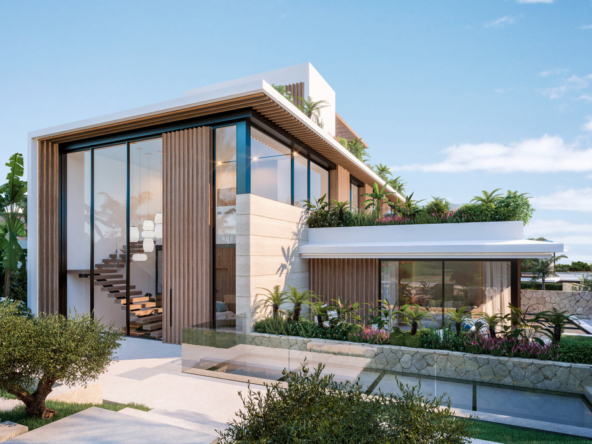 Modern luxury villa in Marbella with floor-to-ceiling windows, lush landscaping, and contemporary design elements.